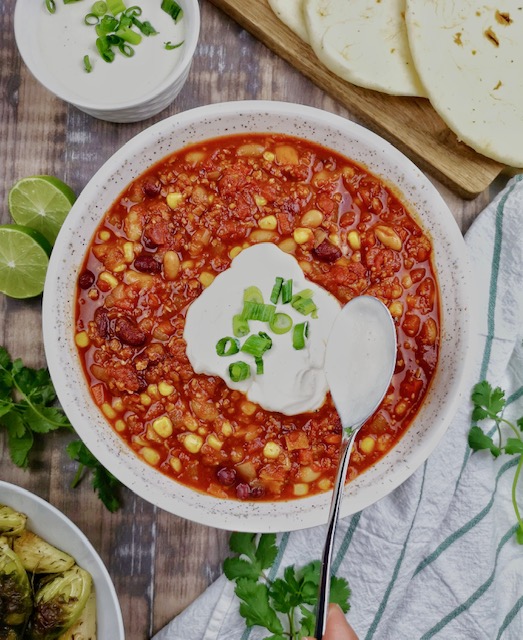 Bowl of Chili with sour cream or plain yogurt and chives