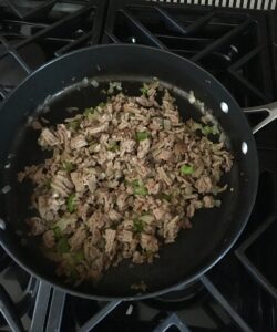 cooking the onions and turkey meat for chilli
