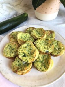 Plate full of zucchini frittata muffins.