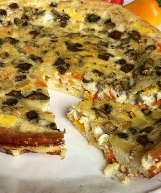 slice of crustless veggie frittata quiche