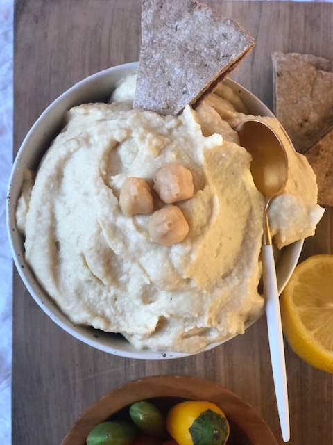 Hummus in a bowl with whole wheat pita bread Hummus in a bowl with whole wheat pita bread