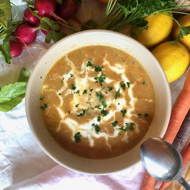 Persian Cream of Barley Soup with yogurt and parsley garnish