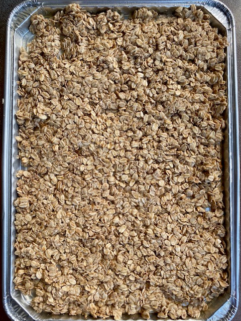 Sugar-free granola base in baking tray Sugar-free granola base in baking tray
