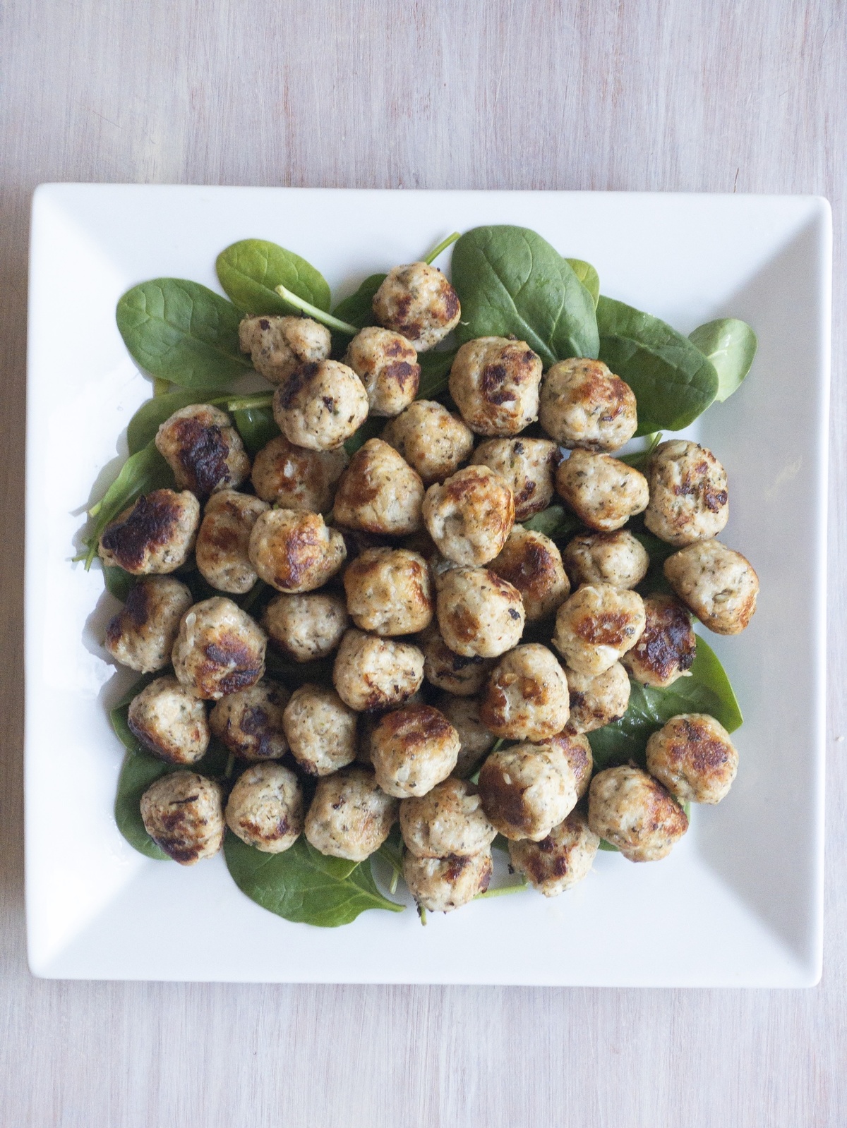 Lean ground turkey meatballs served on a platter of baby s