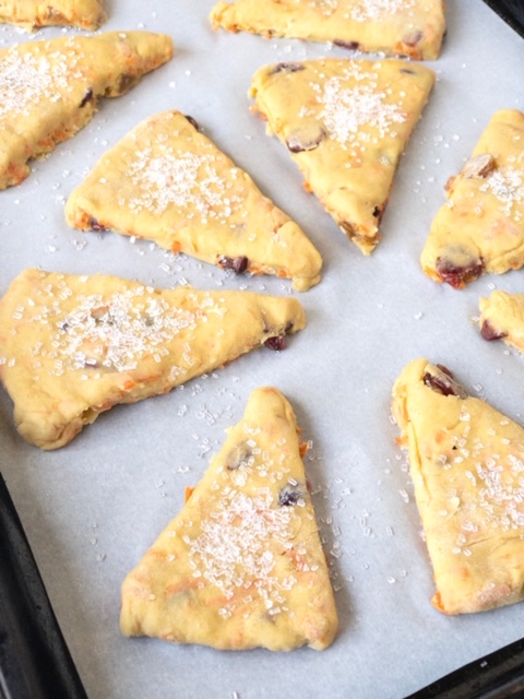 placement of carrot tahini scones on a baking sheet lined with parchment paper placement of carrot tahini scones on a baking sheet lined with parchment paper