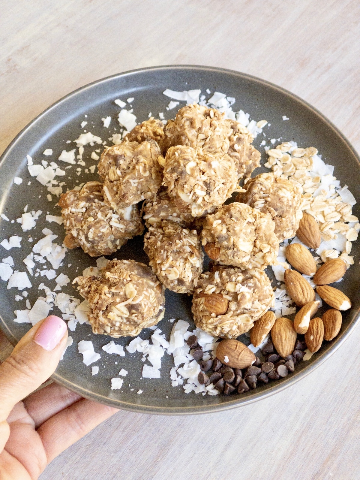 Gray plate of coconut energy balls.