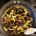 frying the lentil toppings together in a pan
